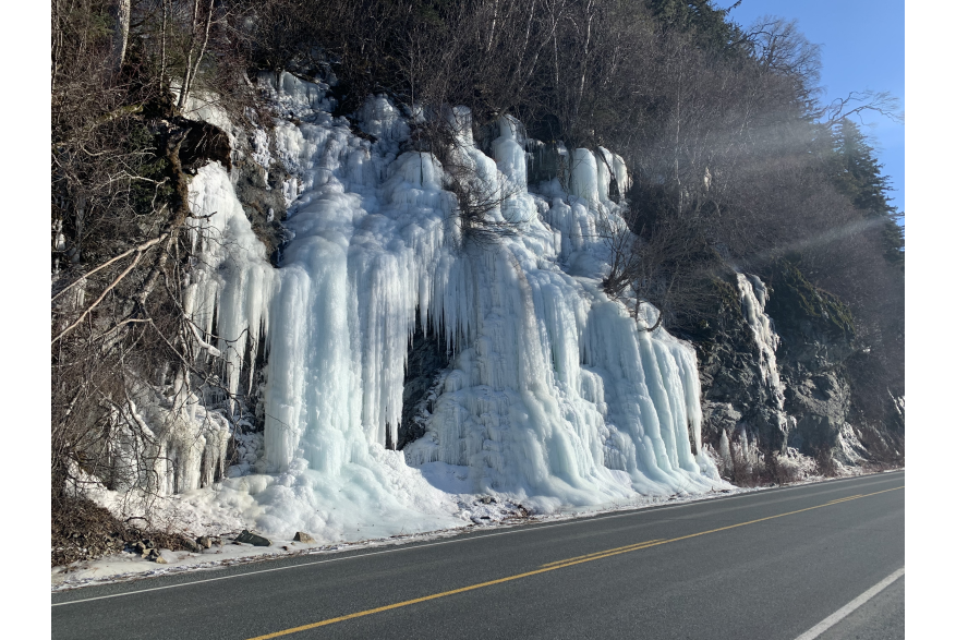 Frozen spring water stream along Mud Bay road