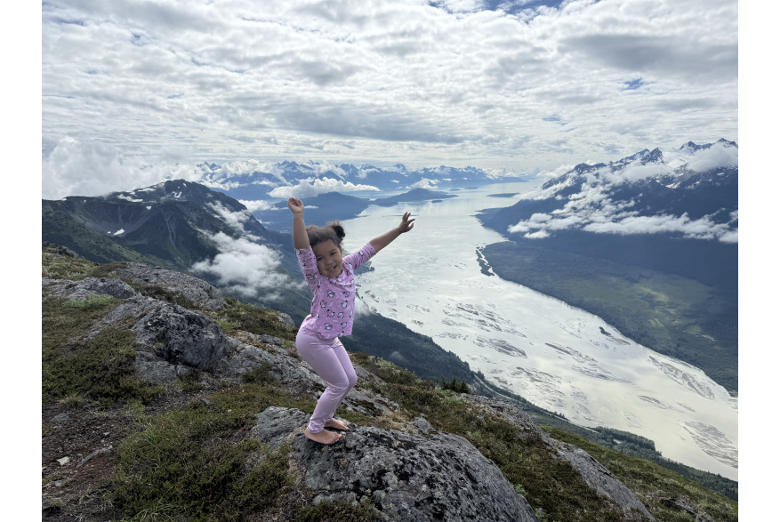 Dancing our way to the top of Chilly Ridge, child posing over the valley from Chilly Ridge