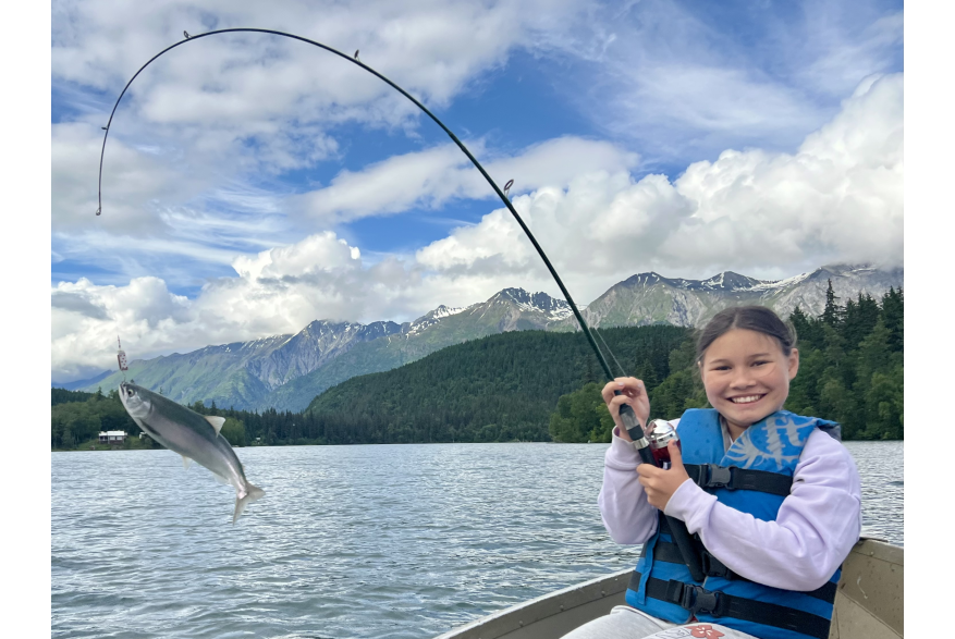 Child Fishing with fish on pole - Middle of chilkat lake