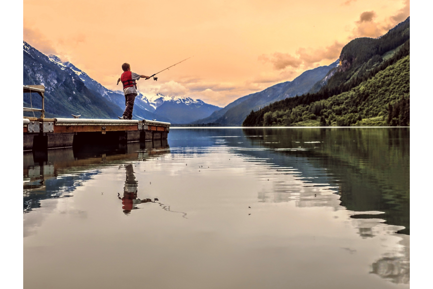 boy fishing at dusk Chilkoot lake boat launch