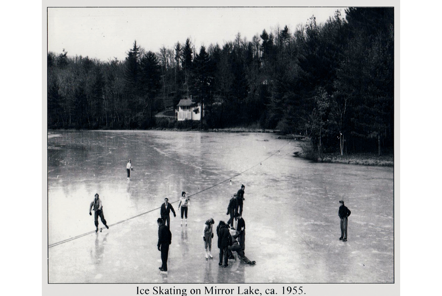Ice skating on Mirror Lake under the lights. Mirror Lake and Lake Sequoyah supplied both ice for food storage and recreation before general warming led to milder winters.  Photo ca. 1955.