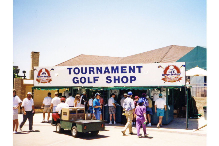 Booth at a golf tournament that says tournament golf shop