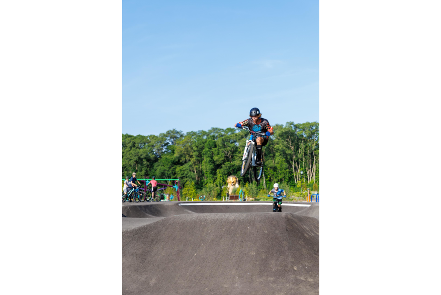 Biker jumping at the pump track