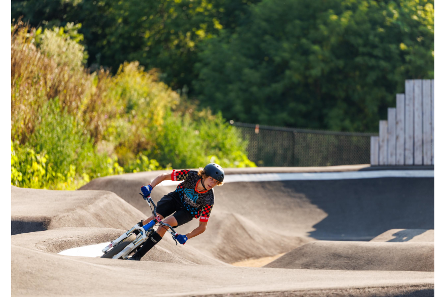 Kid riding in pump track