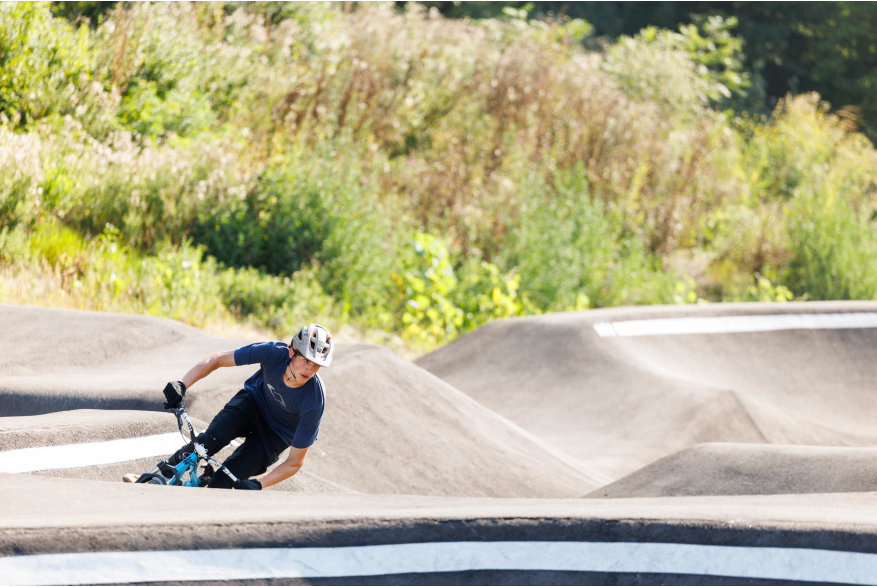 Kid riding in pump track