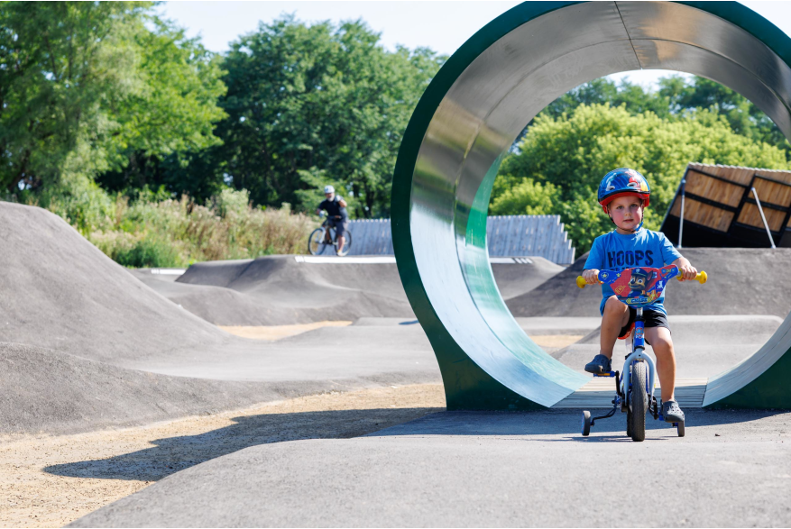 Child riding through tunnel