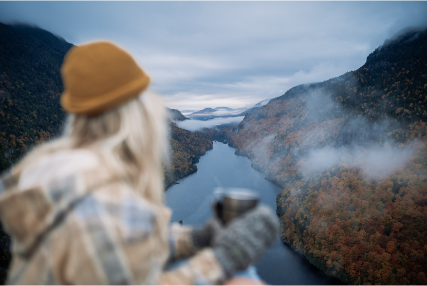 woman looks out at a fjord