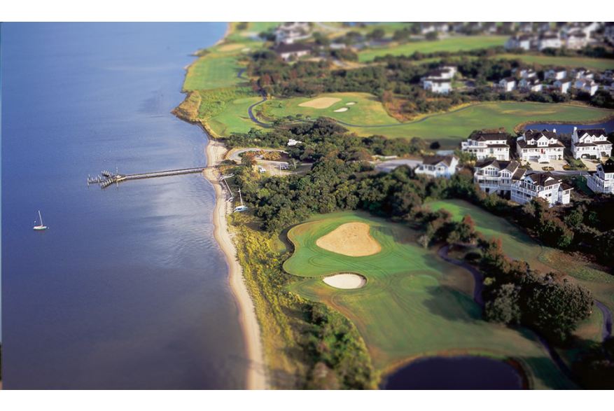 Aerial view of a golf course along the coast in the Outer Banks