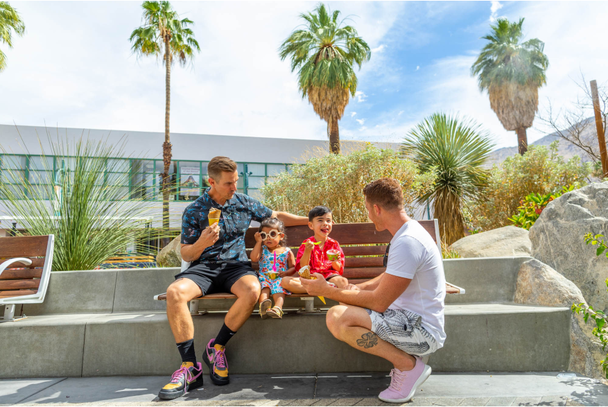 Gay family eating ice cream outdoors in Palm Springs.