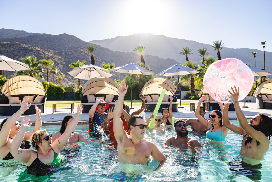 Group of triends partying in pool.