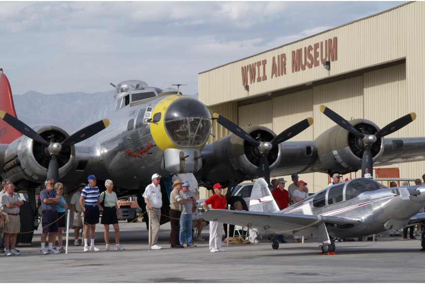 Group around a WWII plane at the Palm Springs Air Museum