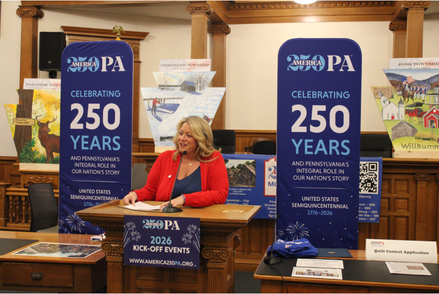 An individual speaking at Monroe County's America250PA kick-off event