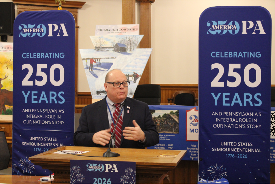 An individual speaking at Monroe County's America250PA kick-off event
