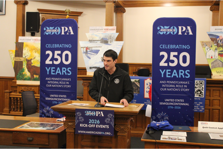An individual speaking at Monroe County's America250PA kick-off event