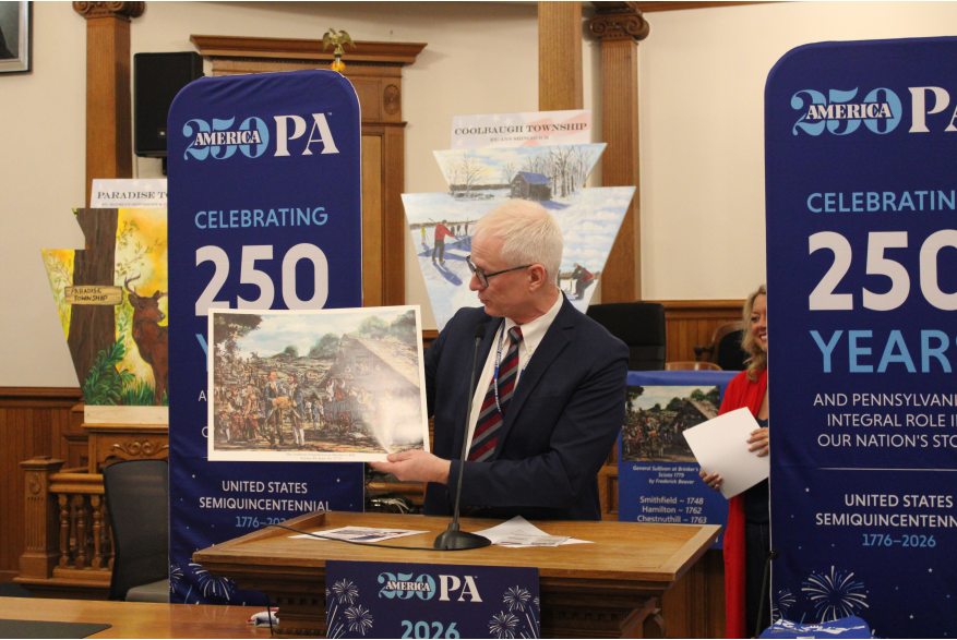 An individual speaking at Monroe County's America250PA kick-off event
