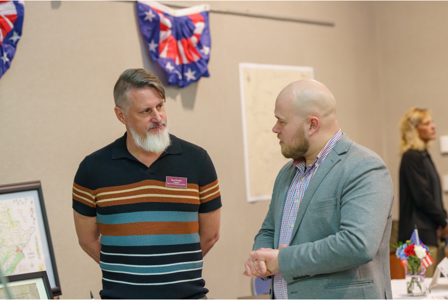 Two men socializing at Monroe County's America250PA Kick Off Event