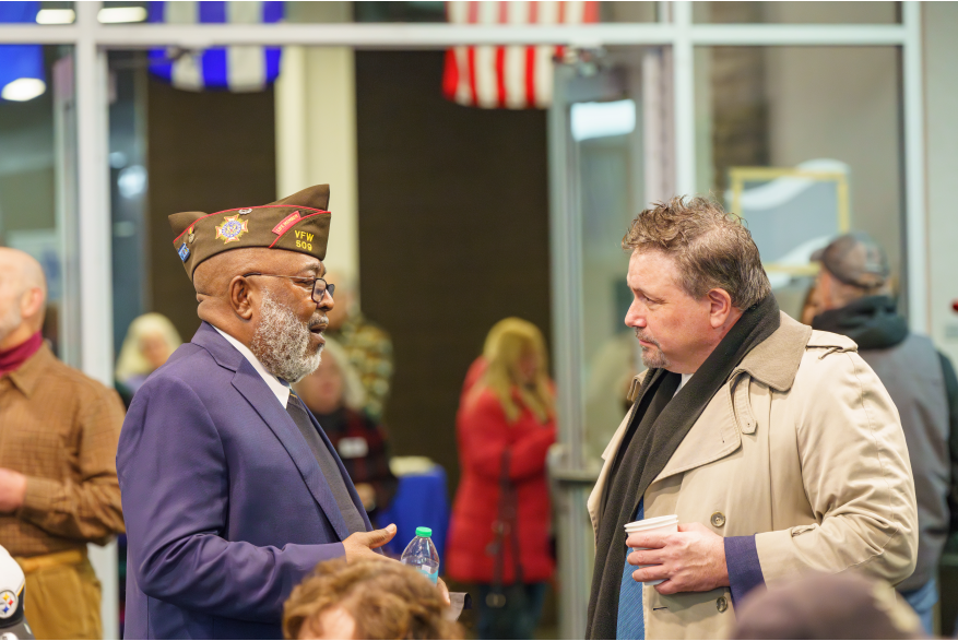 Two men socializing at Monroe County's America250PA Kick Off Event