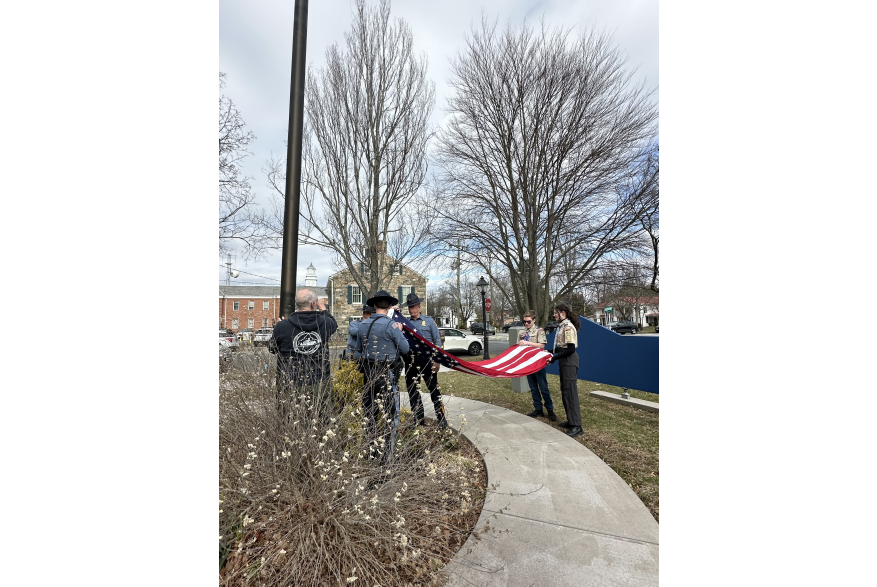 Local scouts and Pike County Sheriff’s Office raising the flag at the Flags Across the Commonwealth event.