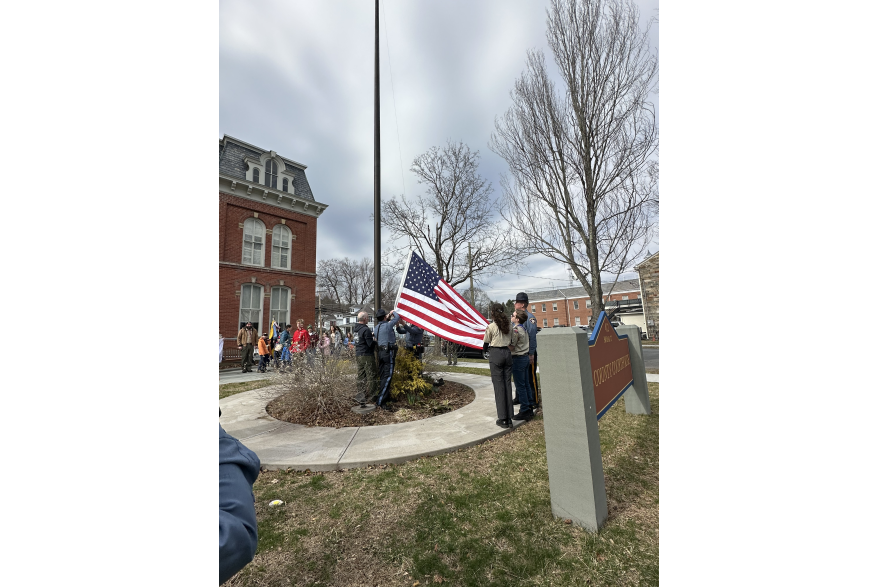 Local scouts and Pike County Sheriff’s Office raising the flag at the Flags Across the Commonwealth event.