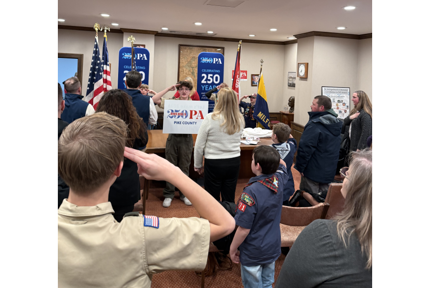 A group saluting during the Pike County's America250PA kick-off event