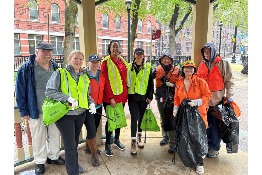 A group posing outside while volunteering for Pick Up The Poconos