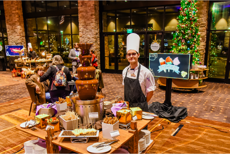 A chef posing with one of the dining options during the reception at More Front Doors: The Pocono Housing Summit