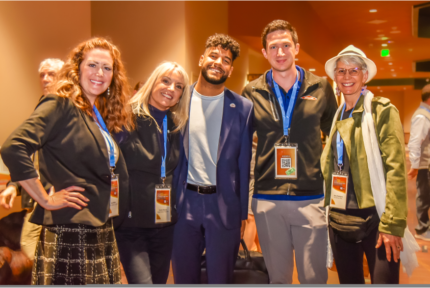 A group of attendees posing for a picture during the reception at More Front Doors: The Pocono Housing Summit