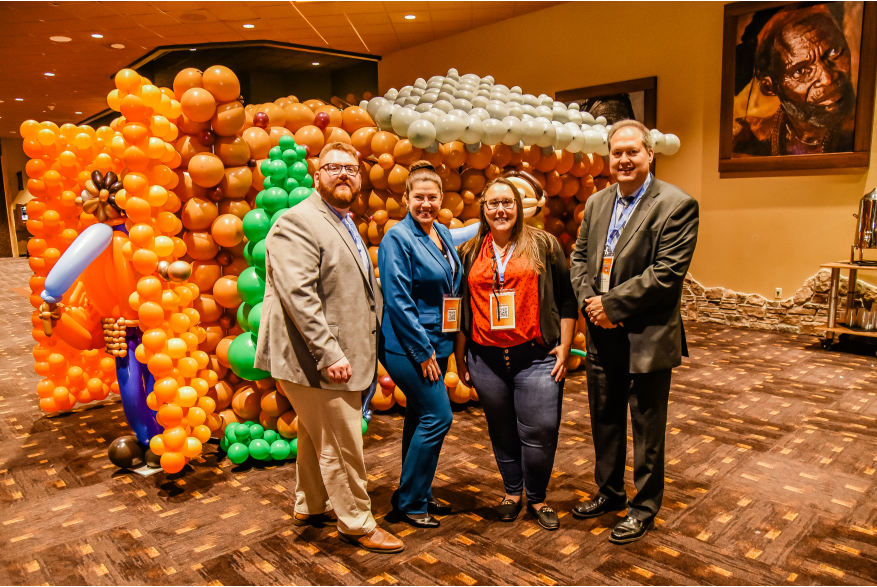 A group of attendees posing for a picture during the reception at More Front Doors: The Pocono Housing Summit