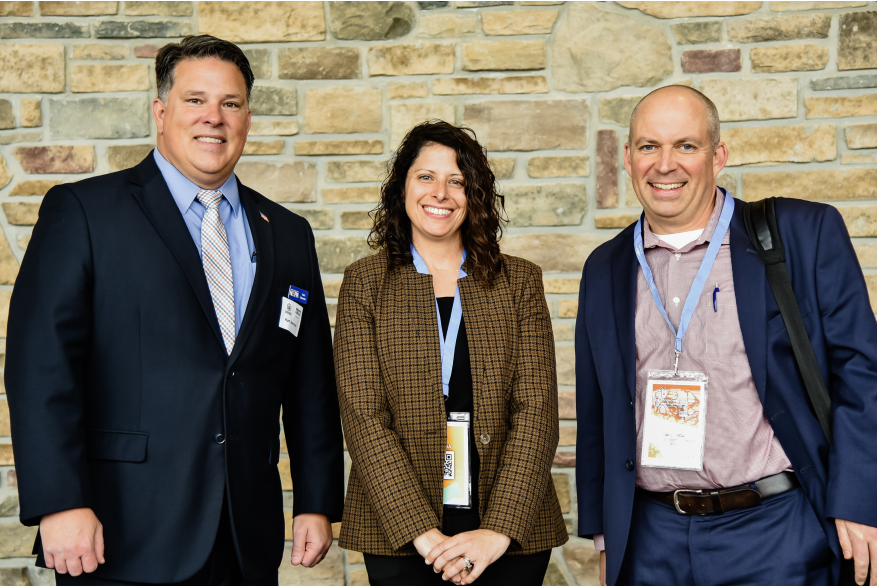 Group of attendees smiling for a photo during More Front Doors: The Pocono Housing Summit