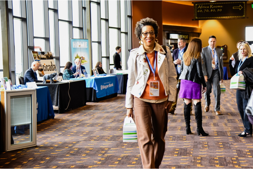 A women walking through the vendor showcase at More Front Doors: The Pocono Housing Summit
