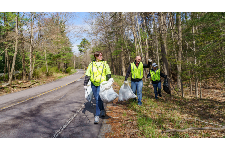 Trash being picked up along the road