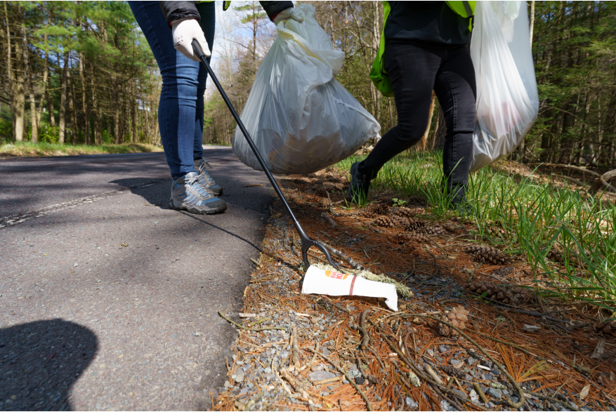 Trash being picked up along the road