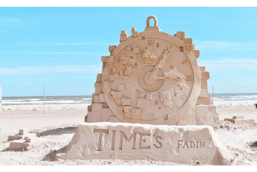 Clock sculpture made of sand.