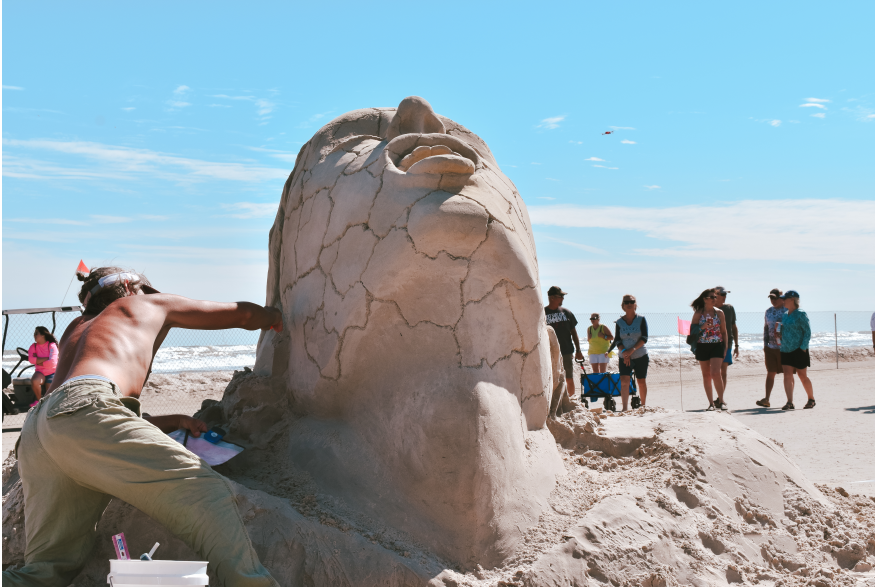 Man Working on Sand Sculpture