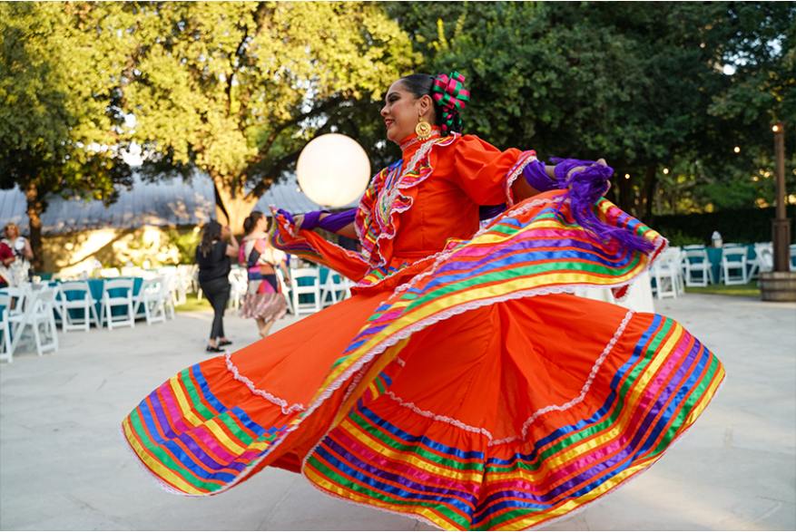Woman dancing in red Folklorico dress
