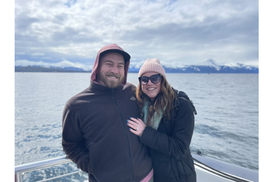 Picture of newly engaged couple with ocean and water in background