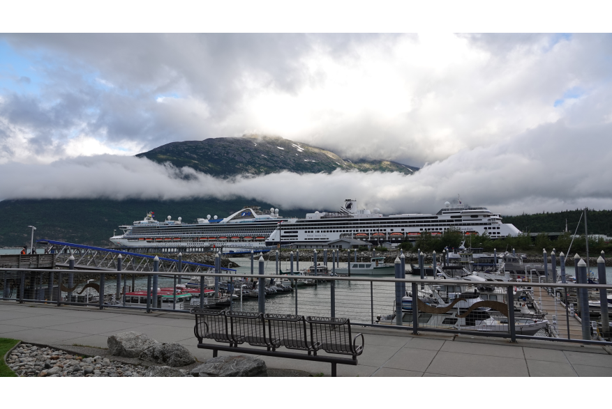 Cruise Ships early morning in Port at Skagway, with dramatic low clouds as the sun rises