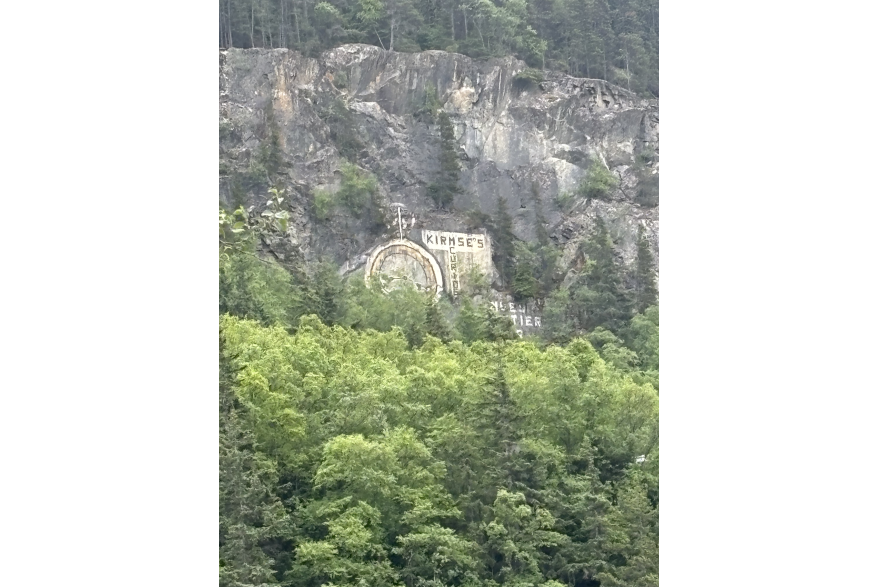 Kirmse's Curious Clock Painting on Mountain in Skagway