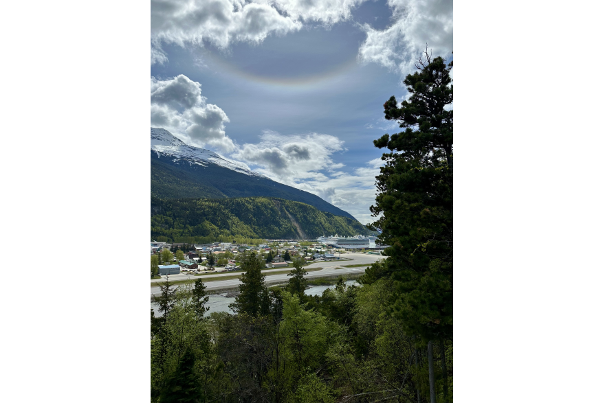 RAINBOW ABOVE IN CLOUDS PEEKING AT SHIPS ON BUSY DAY