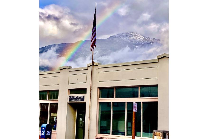 Early morning rainbow over USPS building