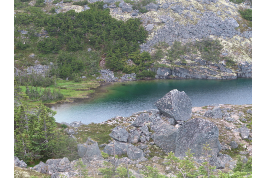 Beautiful emerald lake from glacier melting ice within mountains