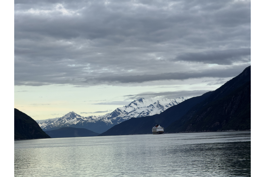 A photo of a cruise ship leaving Skagway from Yakutania Point.