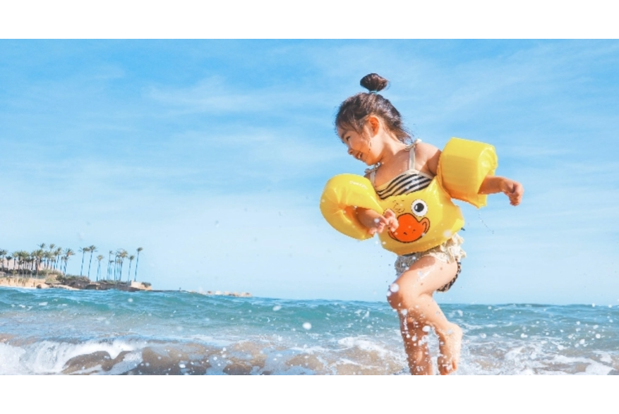 Child splashing on beach