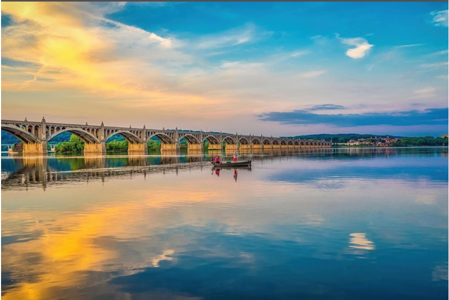 people boating at sunset along the Susquehanna River