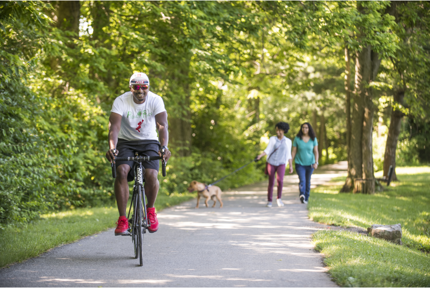 People biking and walking along the rail trail