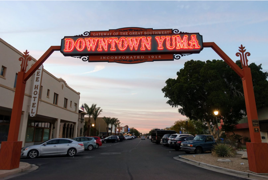 Downtown Yuma sign lit at twilight