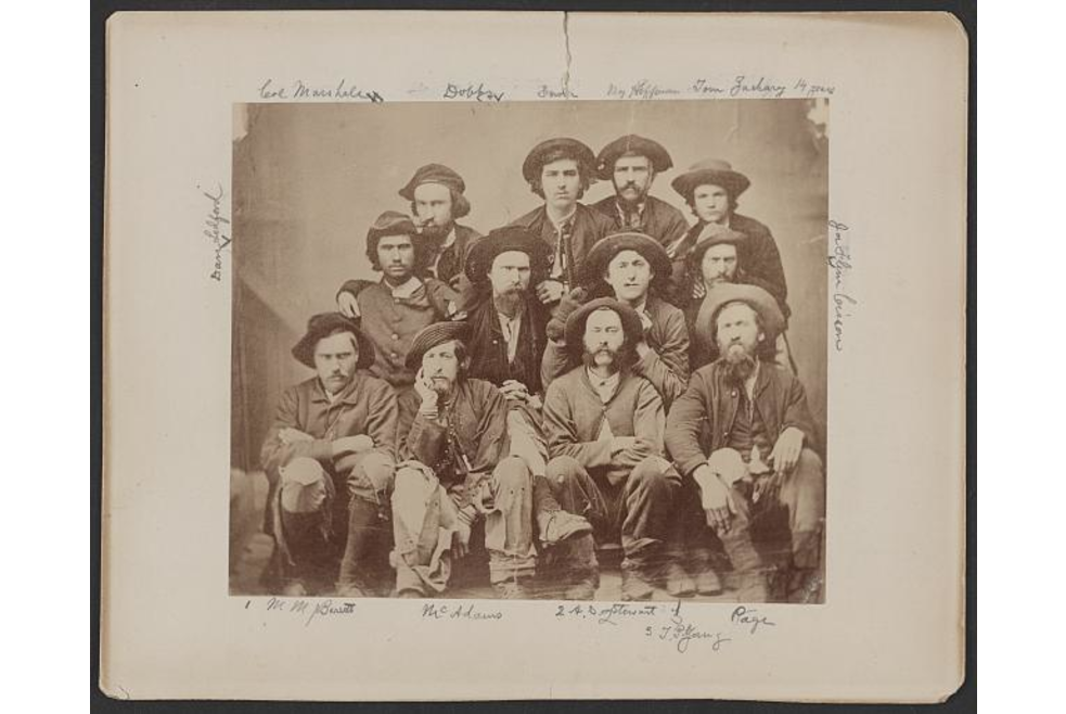 Photograph shows group portrait of former prisoners of war and guides taken upon their arrival at Knoxville, Tennessee, on January 1, 1865.