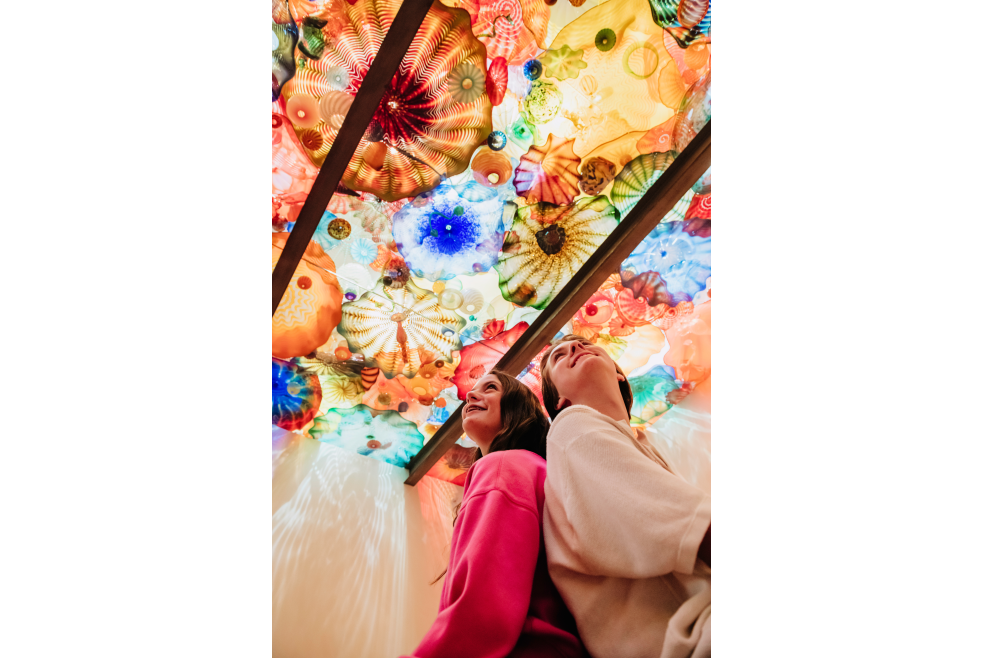Two people looking at Chiluly art at the Oklahoma City Museum of Art