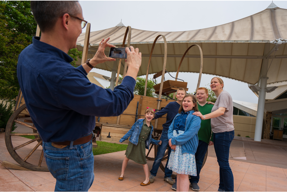 Family posing outside of Oklahoma City's National Cowboy & Western Heritage Museum