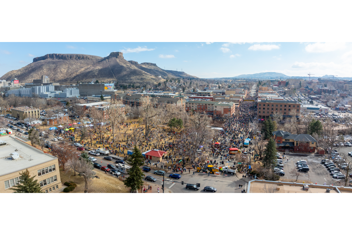 Aerial drone panoramic of Goldens in Golden 2025 event in downtown Golden, CO with people and their dogs gathering